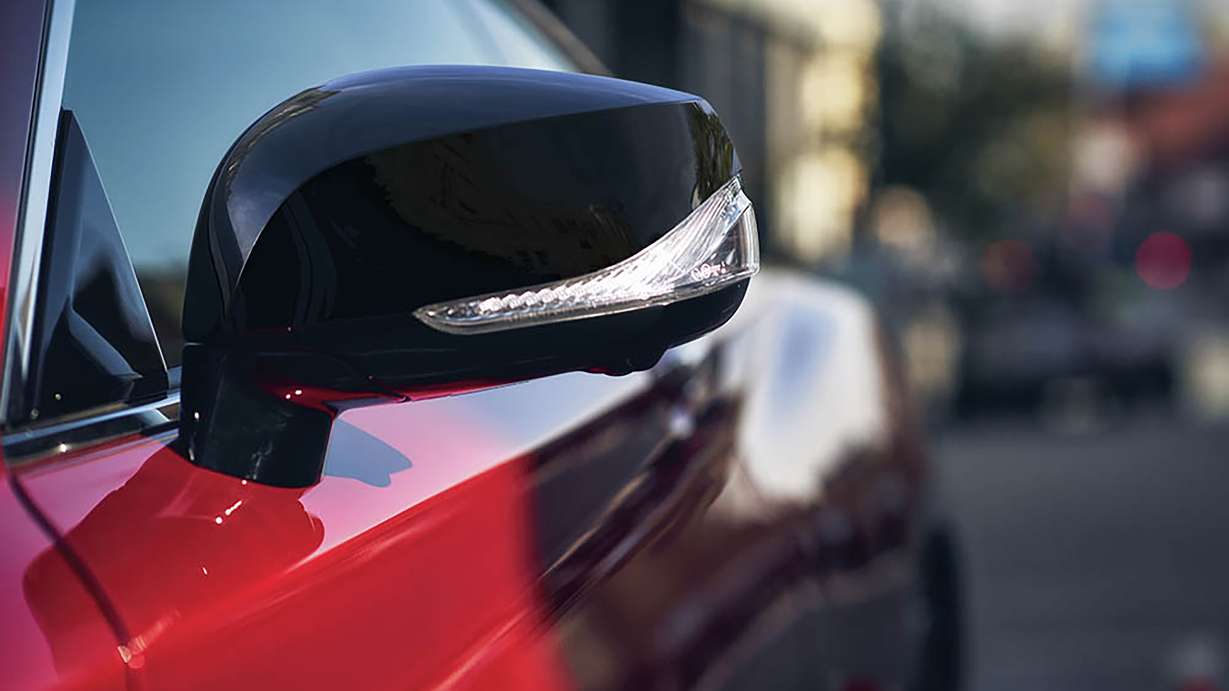 2022 INFINITI Q60 red car black mirror caps.